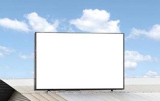 Outdoor billboard on roof and blue sky background with white background mock up. clipping path photo