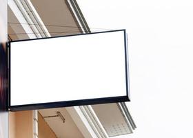 Billboard on building and blue sky background with white background mock up. clipping path photo