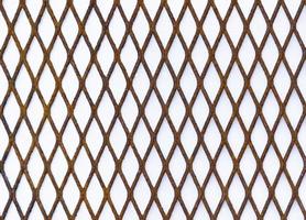 Rusted black grille pattern on white background photo