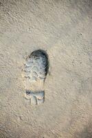 Footstep pattern on a concrete background photo
