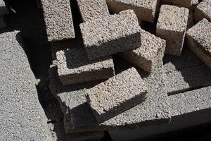On the construction site there are rectangular paving stones. photo