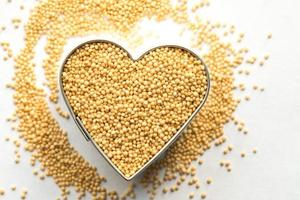 Uncooked Amaranth Grain in a Heart Shape photo