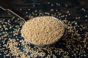 Uncooked Amaranth Grain Spilled from a Teaspoon photo