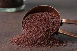 Ground Sumac Spilled from a Teaspoon photo