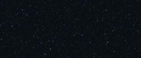 Snowfall bokeh on black background. Many snowflakes in flying in the air. Winte night snowfall and blizzard of snow at. Blur bokeh light effect creative background. photo