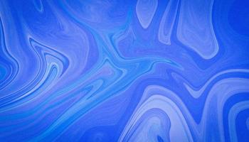 Colorful and fancy colored liquify background. Glossy liquid acrylic paint texture. Liquid fluid abstract marble texture. Abstract liquid blue background. Marble blue abstract background photo