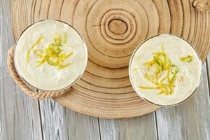 Lemon mousse, lovely French recipe dessert on wooden background photo