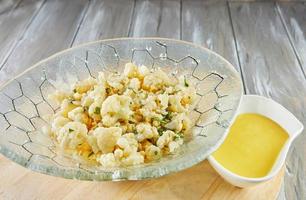 Cauliflower salad with wine vinegar and fresh herbs photo