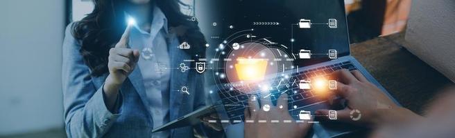 Document management system concept, Businessman signs electronic documents on digital documents, searching and managing files online document database, for efficient archiving and company data photo