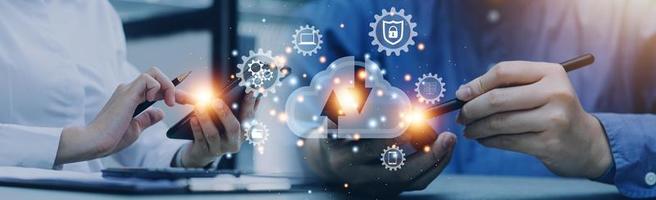 man use Laptop with cloud computing diagram show on hand. Cloud technology. Data storage. Networking and internet service concept. photo