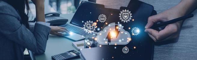 man use Laptop with cloud computing diagram show on hand. Cloud technology. Data storage. Networking and internet service concept. photo