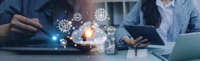 man use Laptop with cloud computing diagram show on hand. Cloud technology. Data storage. Networking and internet service concept. photo