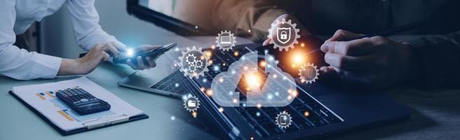man use Laptop with cloud computing diagram show on hand. Cloud technology. Data storage. Networking and internet service concept. photo