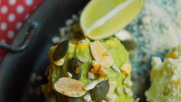 Mexican corn elote in three ways. Pressed with cheese, guacamole and pomegranate. Maxican flag video