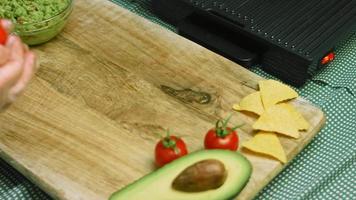 Cut a green and hot pepper into small slices. Macro shooting video