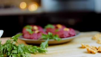 The girl tastes pkhali. Pkhali traditional Georgian food. Beetroot is used for the purple color. Walnut is used for decoration video