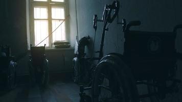 Newly assembled wheelchair for the disabled. Disastrous condition of the room, broken jams video