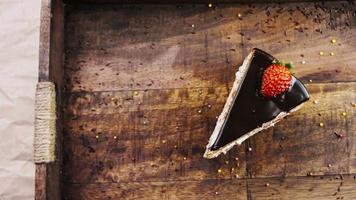 Delicious strawberry cake on a wooden tray with decorations