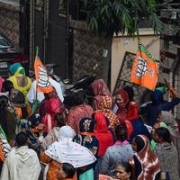 New Delhi, India, November 20 2022 - Bharatiya Janata Party BJP supporters during a rally in support of BJP candidate Pankaj Luthara to file nomination papers ahead of MCD local body Elections 2022 photo