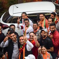 New Delhi, India, November 20 2022 - Bharatiya Janata Party BJP supporters during a rally in support of BJP candidate Pankaj Luthara to file nomination papers ahead of MCD local body Elections 2022 photo