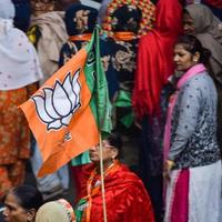 New Delhi, India, November 20 2022 - Bharatiya Janata Party BJP supporters during a rally in support of BJP candidate Pankaj Luthra to file nomination papers ahead of MCD local body Elections 2022 photo