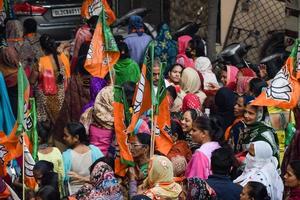 New Delhi, India, November 20 2022 - Bharatiya Janata Party BJP supporters during a rally in support of BJP candidate Pankaj Luthra to file nomination papers ahead of MCD local body Elections 2022 photo