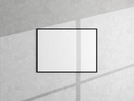 maqueta de marco de imagen de póster mínimo colgado en la pared blanca. maqueta de marco en blanco. marco limpio, moderno y minimalista. representación 3d foto