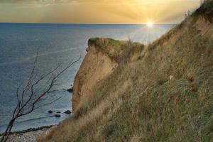 Hundested, Denmark on the cliff overlooking the sea. Baltic Sea coast, grassy photo