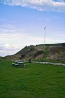 Hundested, Denmark picnic place in front of the cliffs. Flagpole with the Danish flag photo