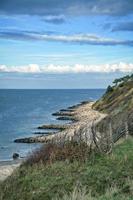 Hundested, Denmark on the cliff overlooking the sea. Baltic Sea coast, grassy photo