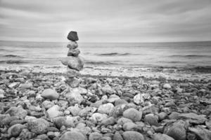 Stone pyramid on the beach overlooking the sea. Danish coast. Scandinavia landscape photo