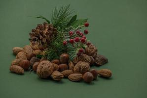 Xmas nuts in a stack with decoration. photo