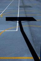 street basketballl hoop shadow on the sports court photo