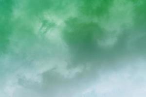 White cloud and green sky background with copy space photo