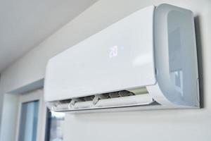 Air conditioner hanging on the wall, close up photo