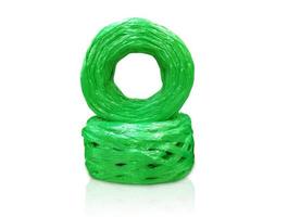 Green plastic rope isolated on white background photo