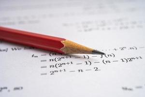 Pencil on mathematic formula exercise test paper in education school. photo