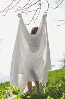 Lady posing with white cloth scenic photography photo