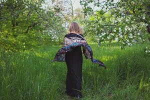 Lady running in beautiful garden scenic photography photo