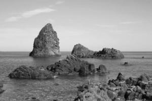 Faraglioni of Acitrezza. Aci Castello Catania. Sicily. photo