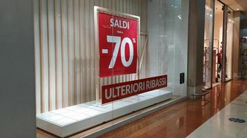 Sale of 70 percento .Sale poster.Shop front sale poster, discount sale marketing info.The red banner on which the sale with discounts is written. photo