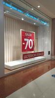 Sale of 70 percento .Sale poster. Shop front sale poster, discount sale marketing info.The red banner on which the sale with discounts is written. photo