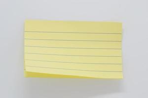 yellow paper with lines for notes, paper background photo