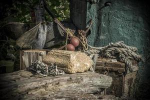 A bunch of old fishermen tools in a yard photo