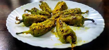 Stuffed Green Chillies fry, Bharwa Masala Mirch or Bharli Mirchi, sandgi Mirchi. photo