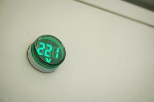 round shape digital LED electricity voltage monitor. photo