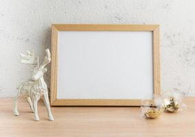 White blank wooden frame mockup with Christmas decorations photo