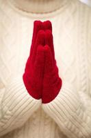 Woman Wearing Red Mittens With Hands Praying photo
