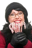 Pretty Woman Holding Candy Canes on White Background. photo