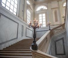 Marble staircase with antique lampposts photo